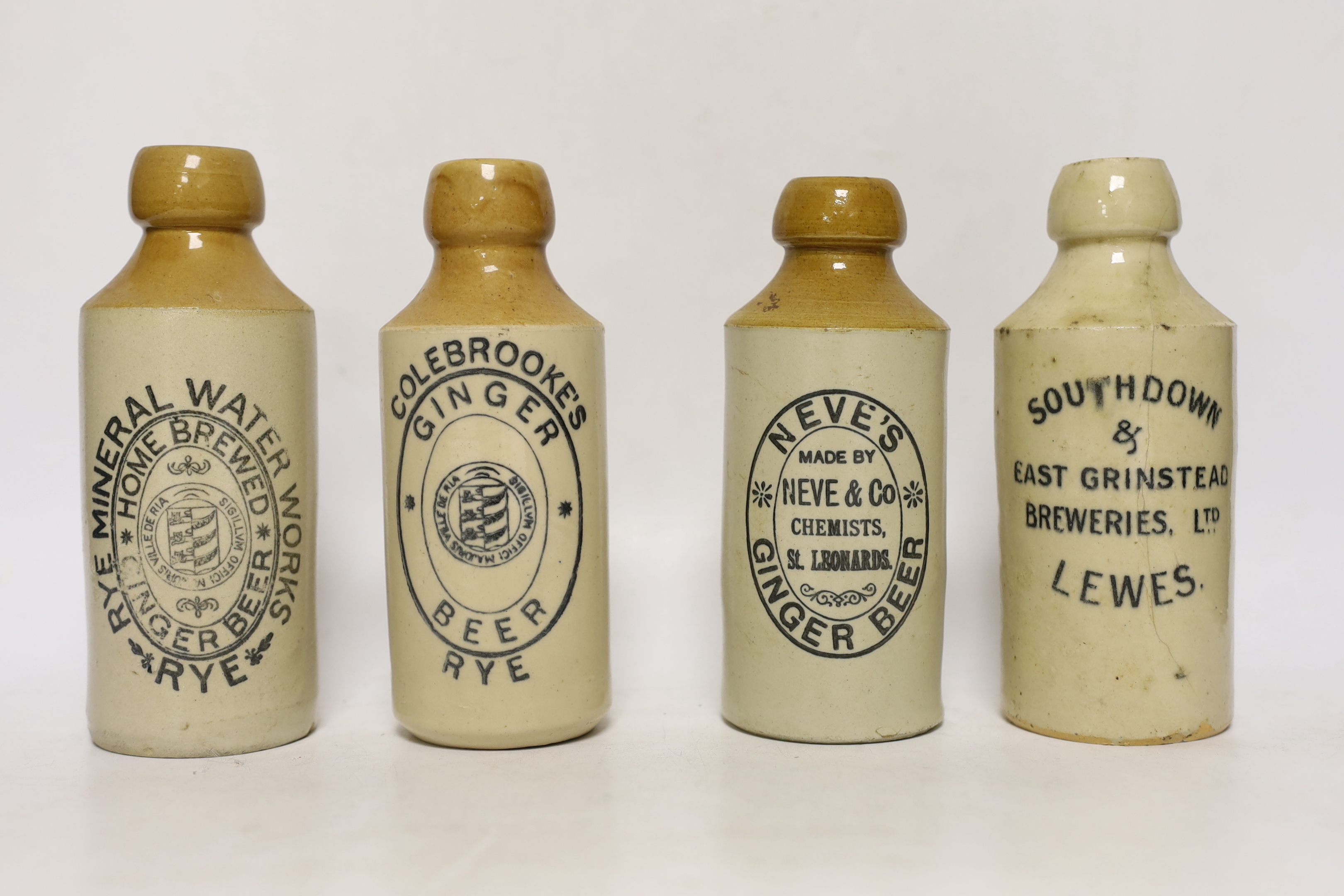 Early 20th century stoneware ginger beer bottles, four from Lewes, three from Hastings, two from Rye and one from St Leonards (10)